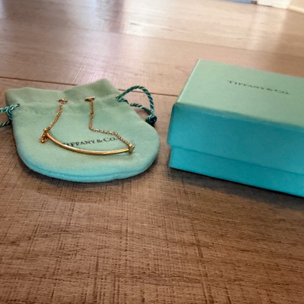 Tiffany & Co. Gold Curved Bar bracelet with Blue Pouch